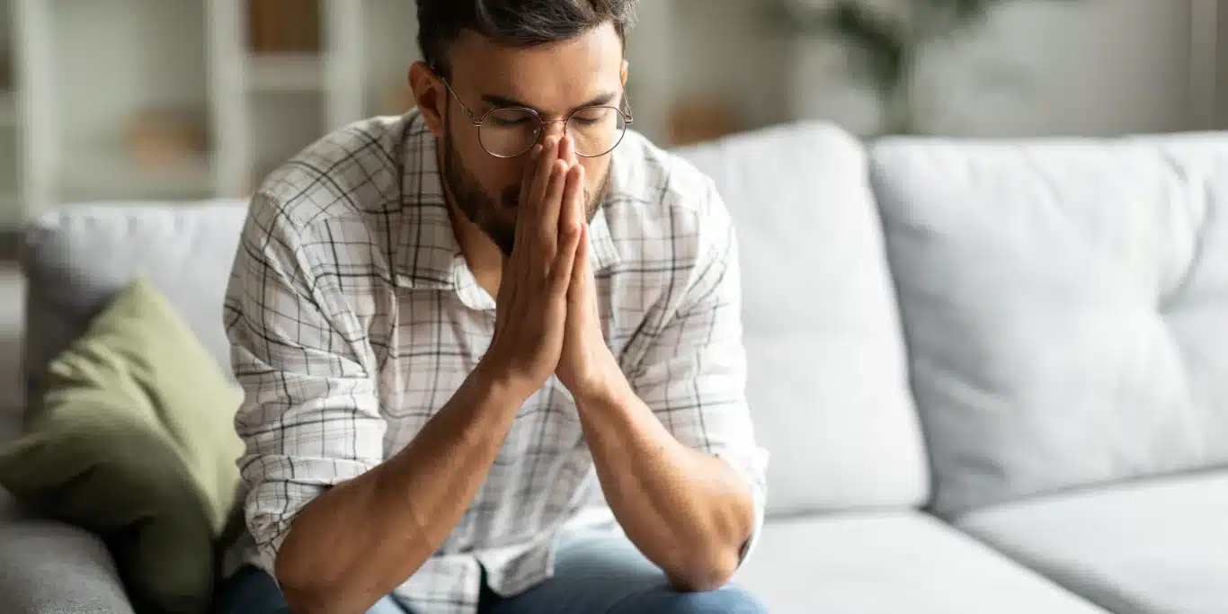 guy sitting on sofa alone